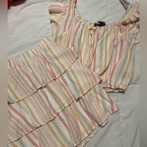 This is a two-piece set with pink, white, coral, orange and green. Size large.